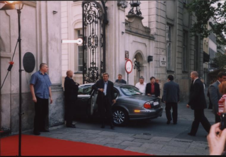 Roman coming out of the car